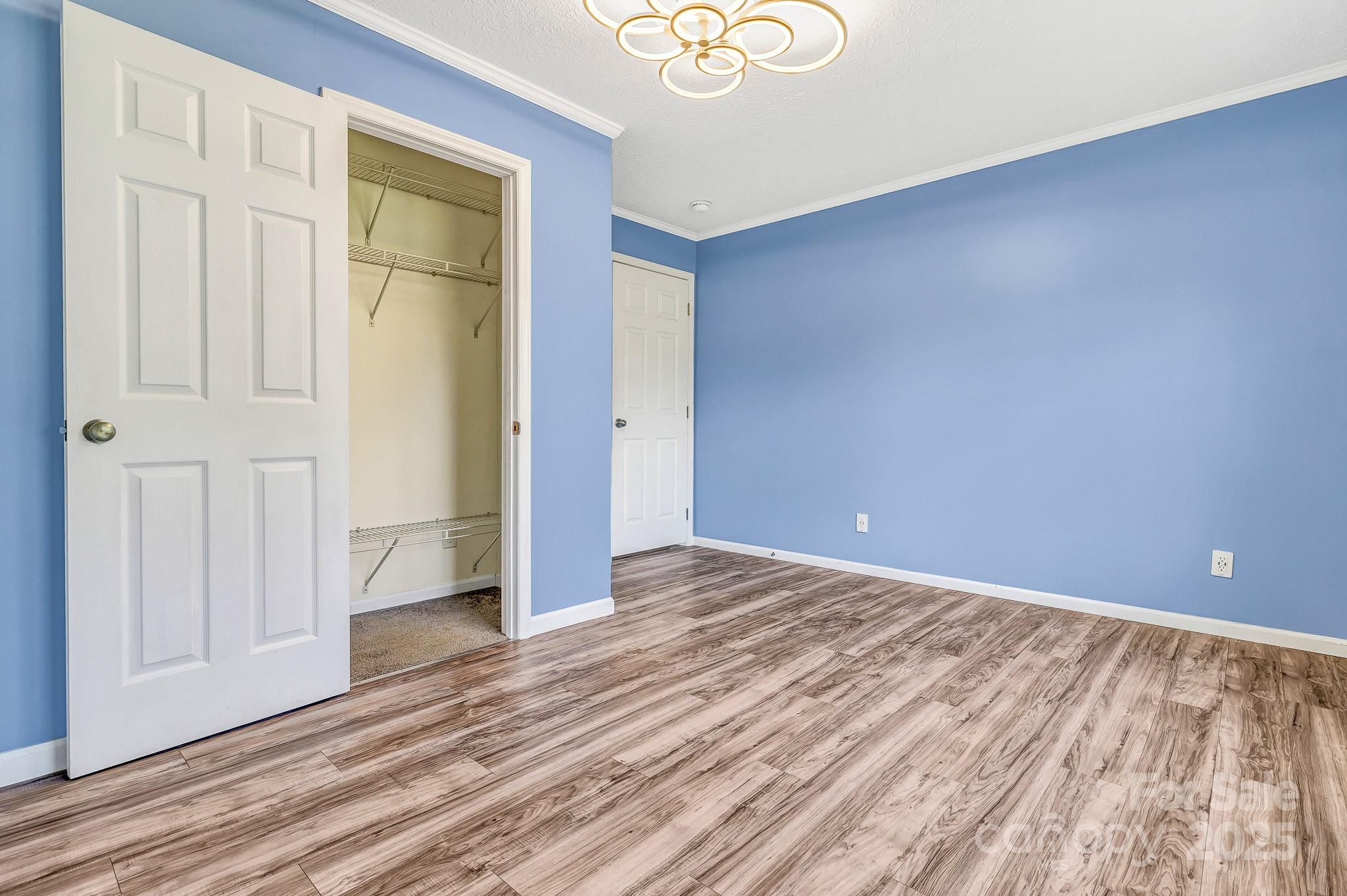 185 Bradshaw Circle Candler, NC 28715 - Photo 26 of 38 a view of an empty room and wooden floor