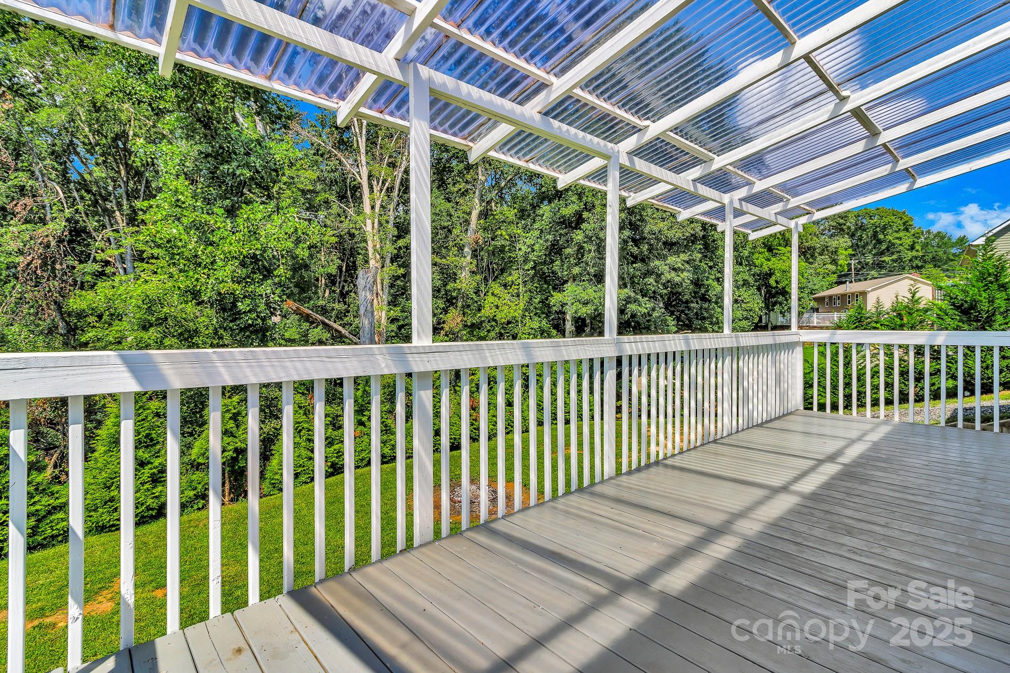 185 Bradshaw Circle Candler, NC 28715 - Photo 31 of 38 a balcony with wooden floor in outdoor space