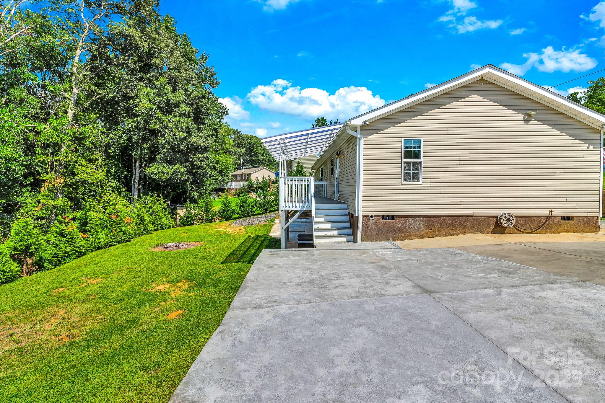 185 Bradshaw Circle Candler, NC 28715 - Photo 7 of 38 a view of a house with a yard