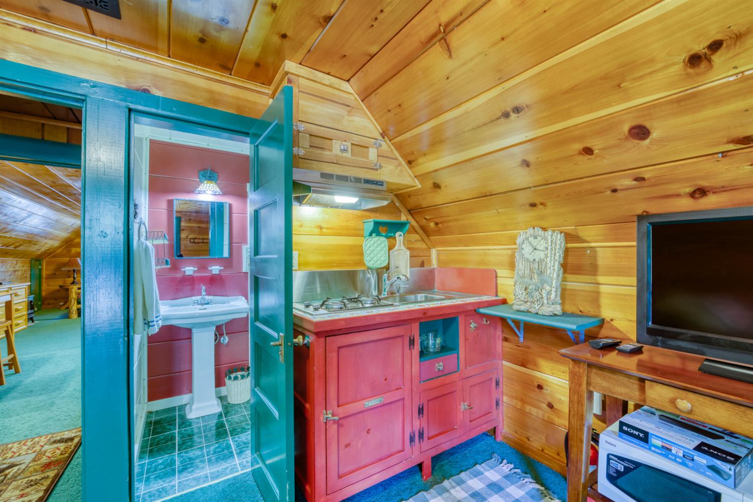 42025 Tollhouse Road Shaver Lake, CA 93664 - Photo 45 of 64 a room with furniture and flat screen tv