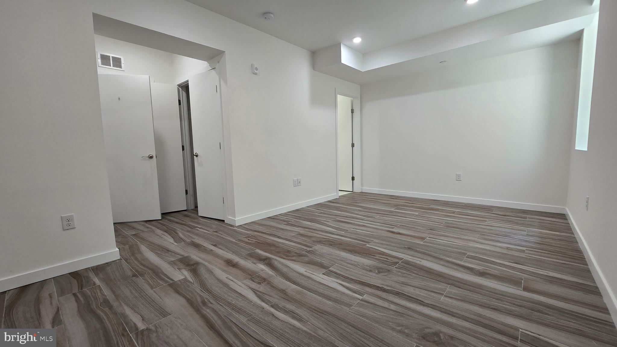 300 Budd Street, Unit C1 Philadelphia, PA 19104 - Photo 13 of 20 a view of empty room with wooden floor