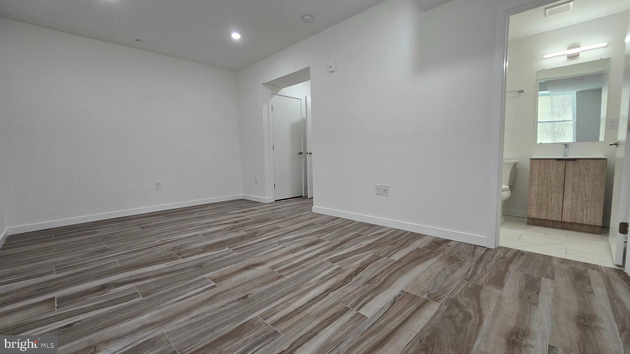 300 Budd Street, Unit C1 Philadelphia, PA 19104 - Photo 16 of 20 wooden floor in an empty room