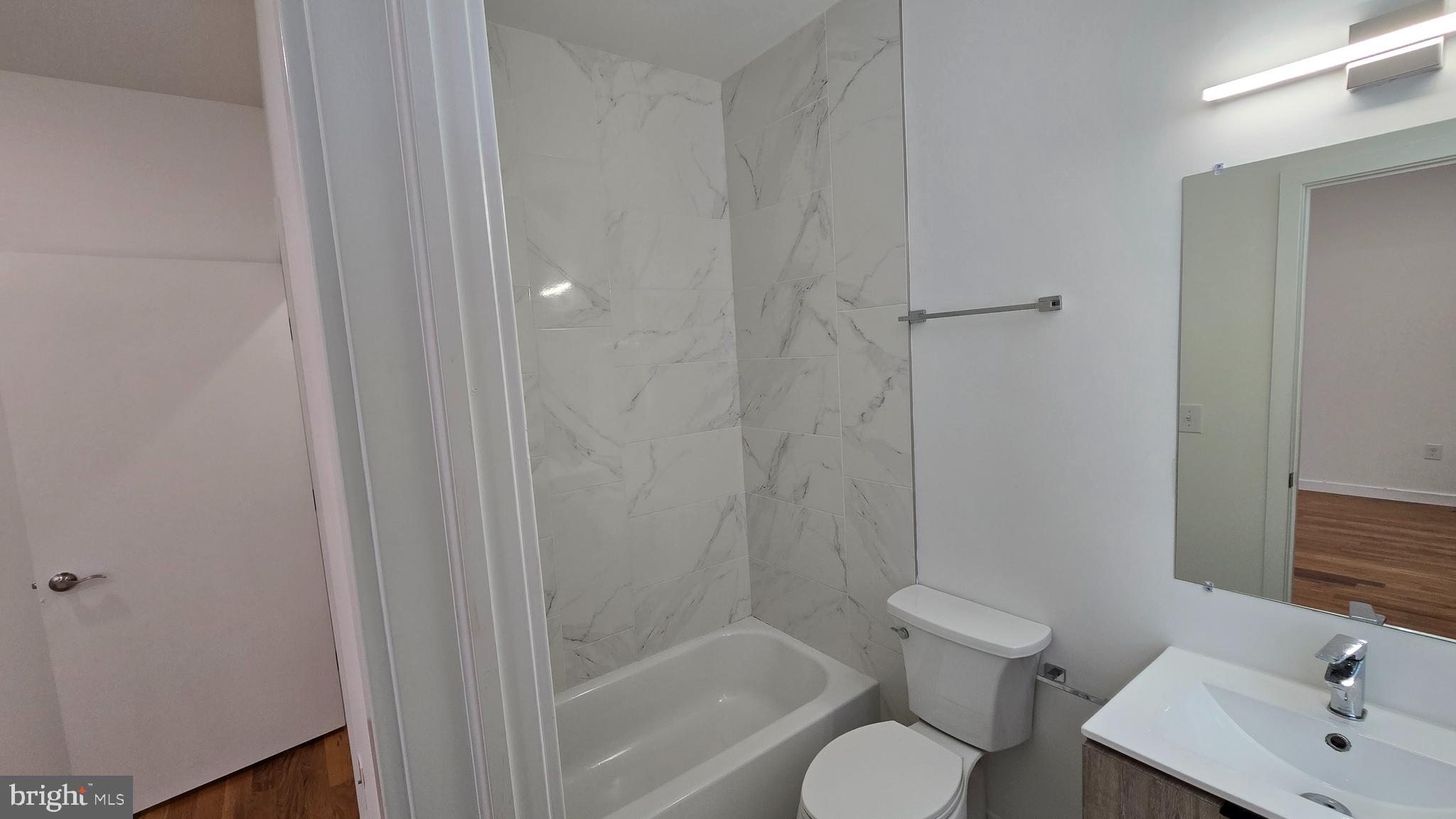 300 Budd Street, Unit C1 Philadelphia, PA 19104 - Photo 10 of 20 a bathroom with a sink toilet and shower