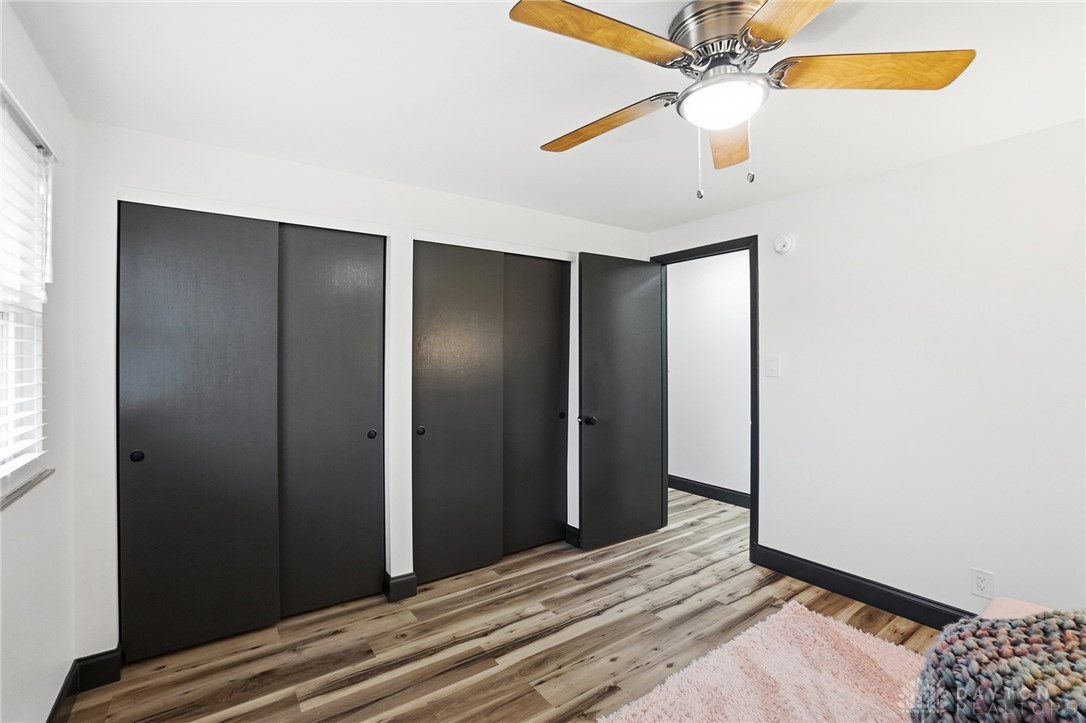 1628 Yorkshire Court Springfield, OH 45503 - Photo 26 of 47 This inviting bedroom features rich hardwood flooring and a functional ceiling fan for comfort.