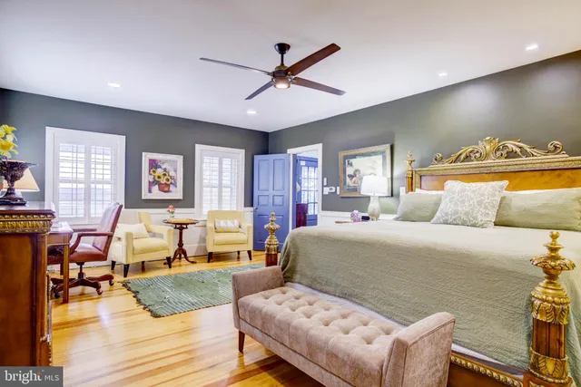 a kitchen with granite countertop a refrigerator stove top oven and sink