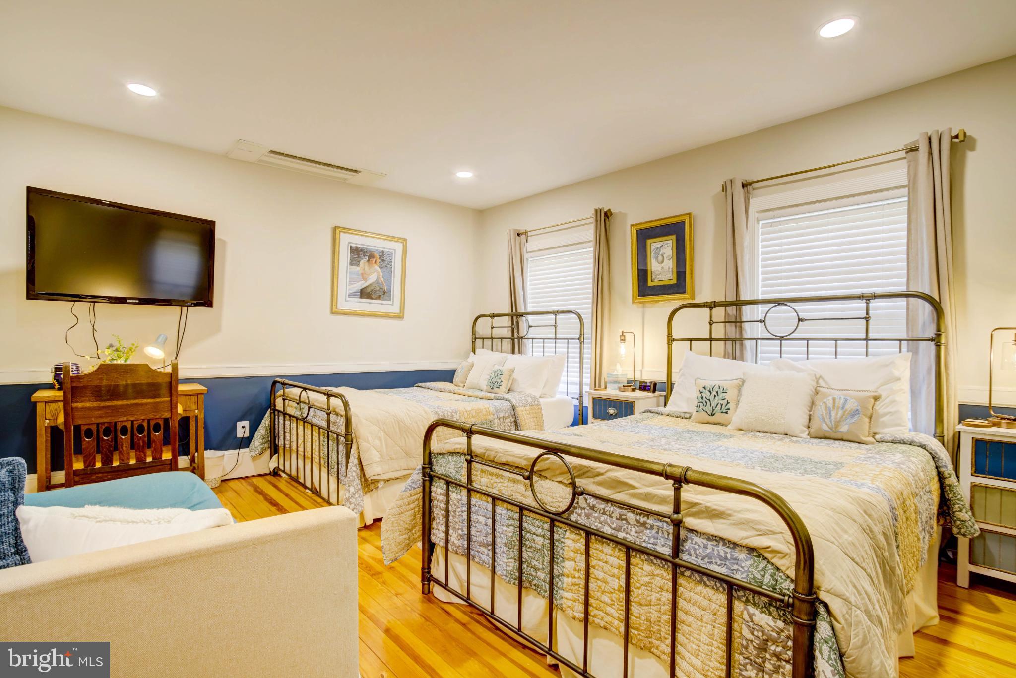 24800 Pealiquor Road Denton, MD 21629 - Photo 13 of 114 a bedroom with a bed and a flat screen tv