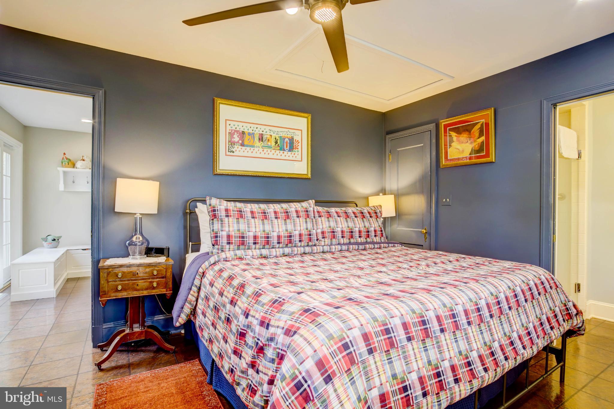 24800 Pealiquor Road Denton, MD 21629 - Photo 14 of 114 a bedroom with a bed and wooden floor