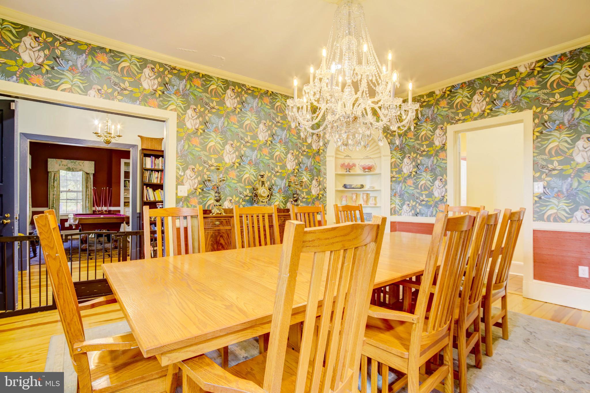 24800 Pealiquor Road Denton, MD 21629 - Photo 16 of 114 a view of a dining room with furniture and a chandelier