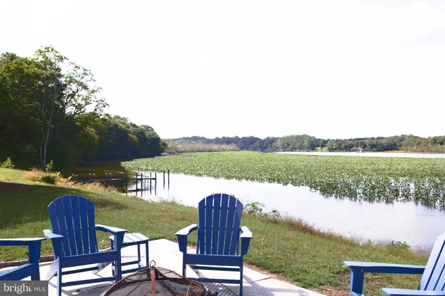 a living room with fireplace furniture and a flat screen tv