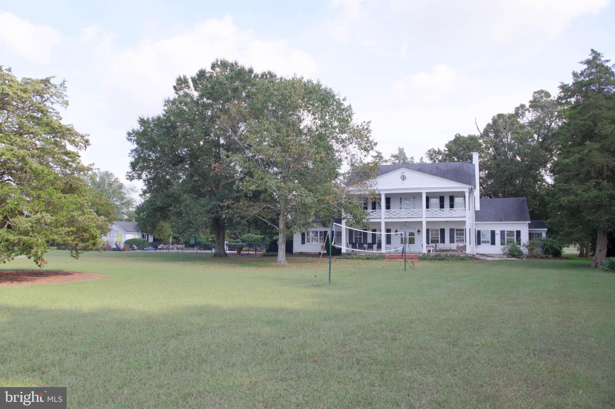 24800 Pealiquor Road Denton, MD 21629 - Photo 26 of 114 a view of a house with a yard and sitting area