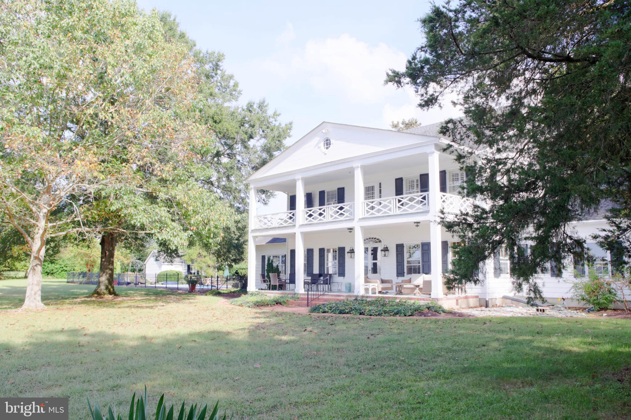 24800 Pealiquor Road Denton, MD 21629 - Photo 28 of 114 a front view of a house with a garden