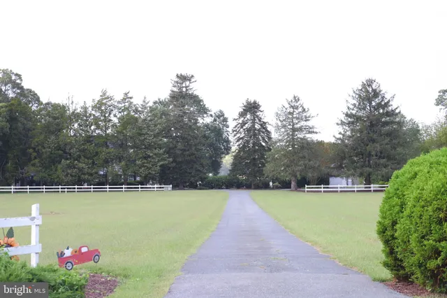 a dining room with furniture and chandelier