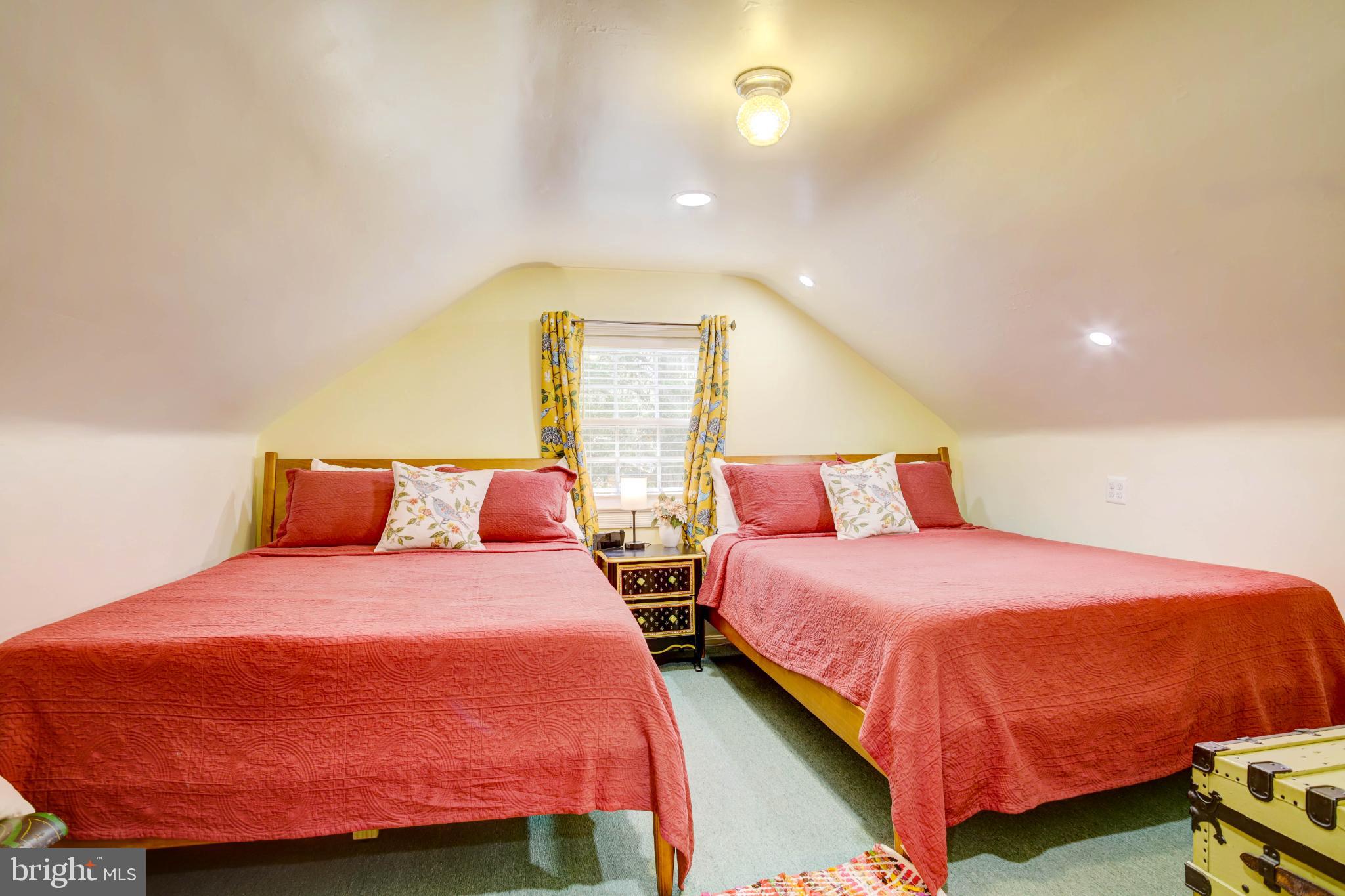 24800 Pealiquor Road Denton, MD 21629 - Photo 37 of 114 a bedroom with two beds and a potted plant