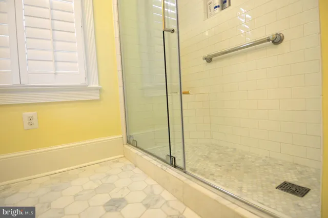 a kitchen with granite countertop a refrigerator oven a sink dishwasher with a dining table and chairs