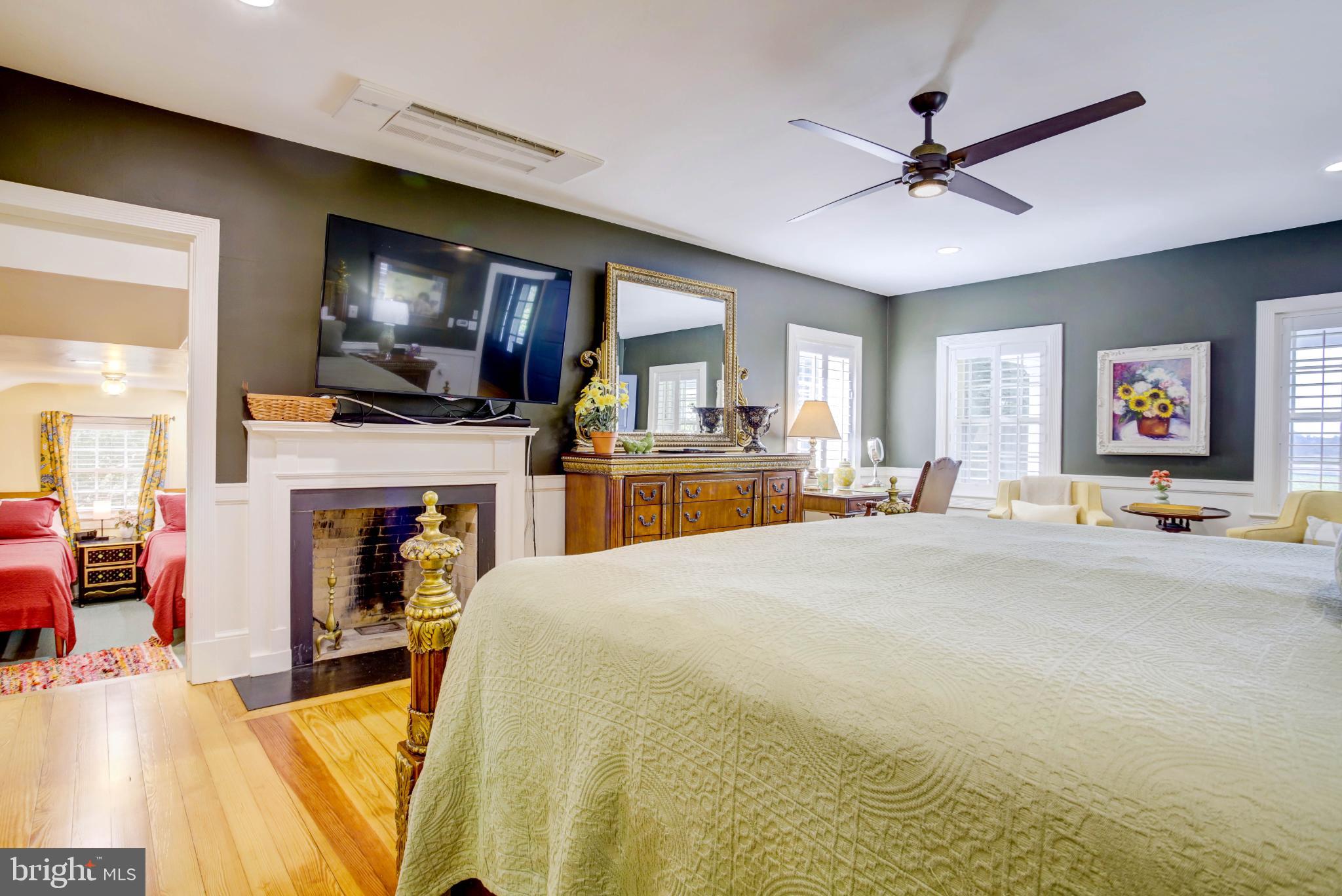 24800 Pealiquor Road Denton, MD 21629 - Photo 48 of 114 a living room with fireplace furniture and a flat screen tv