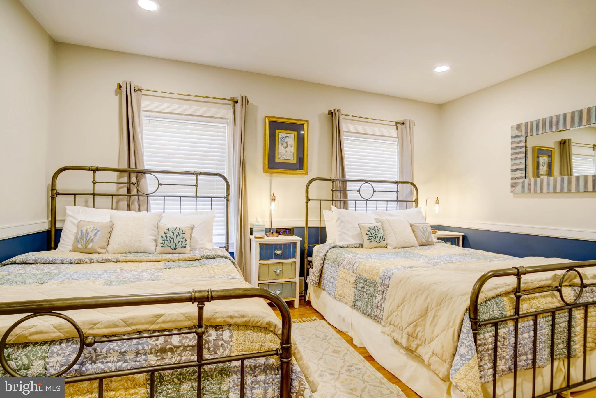 24800 Pealiquor Road Denton, MD 21629 - Photo 58 of 114 a bedroom with a bed and wooden floor