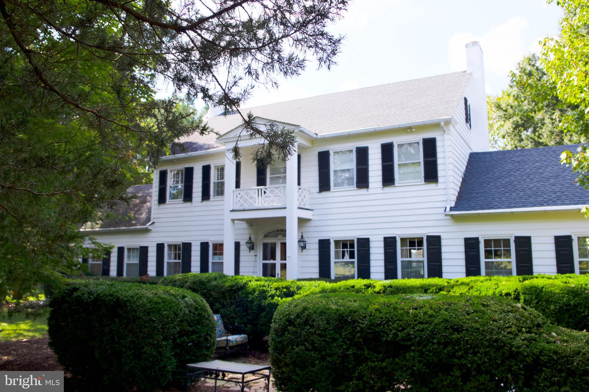 24800 Pealiquor Road Denton, MD 21629 - Photo 6 of 114 a front view of a house with yard and green space