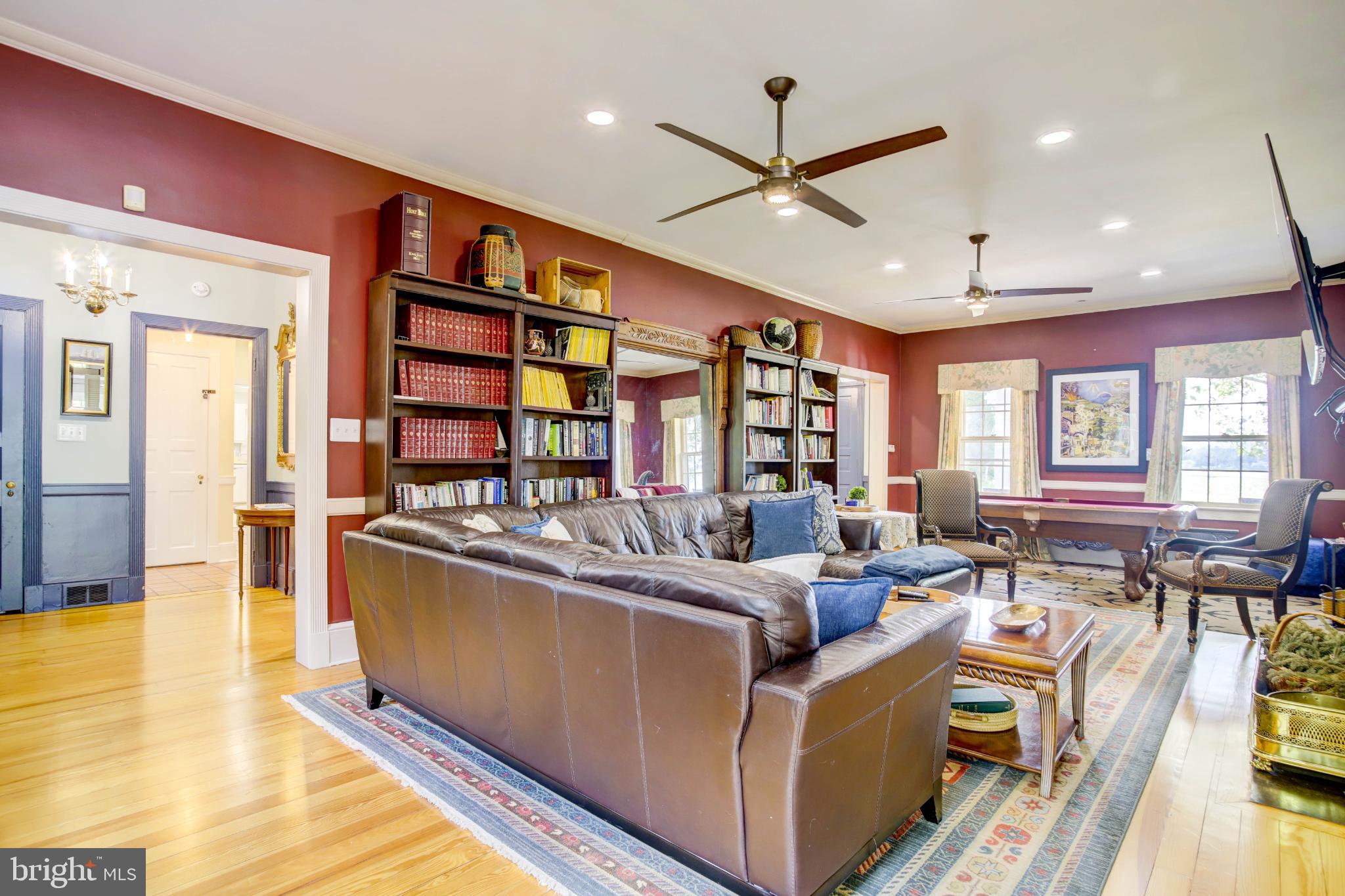 24800 Pealiquor Road Denton, MD 21629 - Photo 73 of 114 a living room with furniture and a flat screen tv