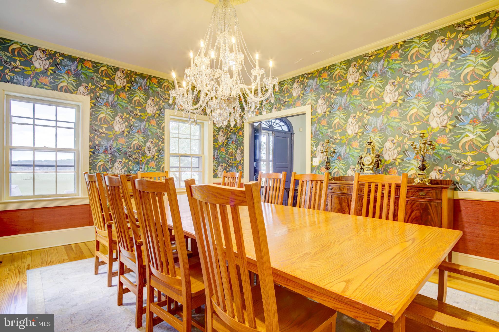 24800 Pealiquor Road Denton, MD 21629 - Photo 82 of 114 a view of a dining room with furniture and a chandelier