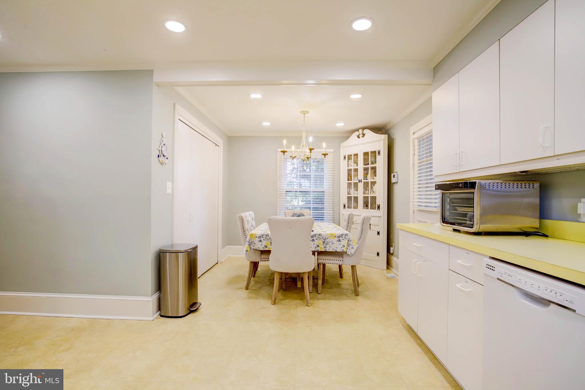 24800 Pealiquor Road Denton, MD 21629 - Photo 90 of 114 a dining room with furniture and a kitchen view