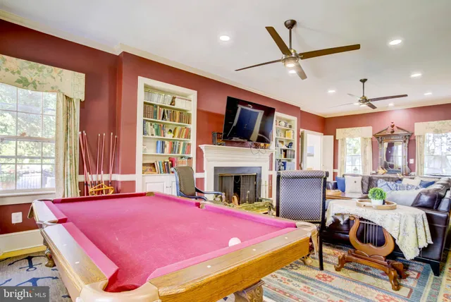 a living room with furniture a rug and a large window