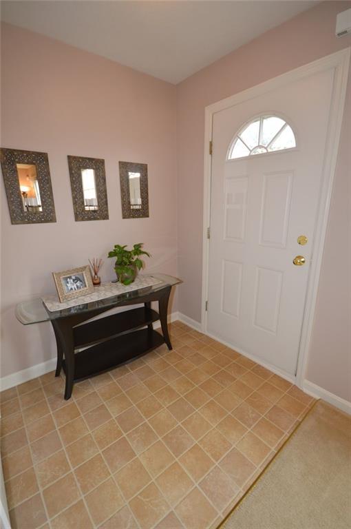 62 Castle View Drive McKees Rocks, PA 15136 - Photo 2 of 22 Inside Front Hallway....Welcome to 62 Castleview Drive in the Castleview Estates Condo Association. This charming well maintained home is in move-in ready condition. Enjoy the 6' x 5' neutral ceramic tile entrance.