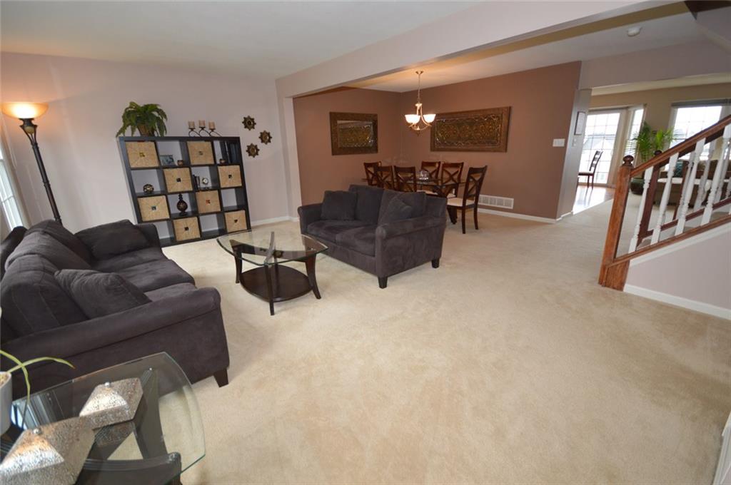 62 Castle View Drive McKees Rocks, PA 15136 - Photo 3 of 22 Living room - 19' x 10' - Enjoy the open floor plan of this charming town home with easy access to the living room, dining room and eat-in-kitchen with updated appliances. This town home is freshly painted with neutral plush carpet in the living room, dining room and family room.