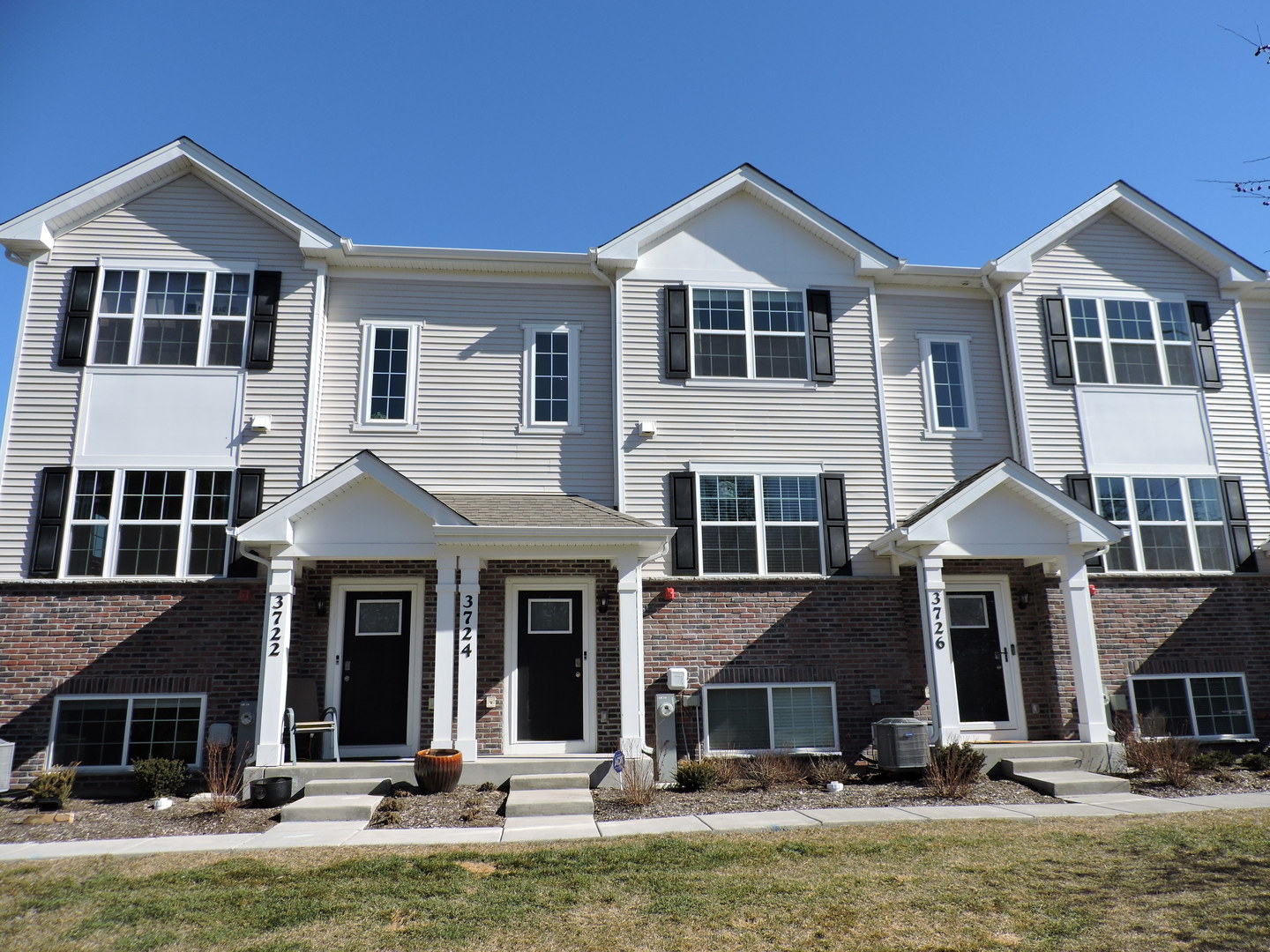 3726 Bailey Road Yorkville, IL 60560 - Photo 2 of 21 a front view of a house with a yard and garage