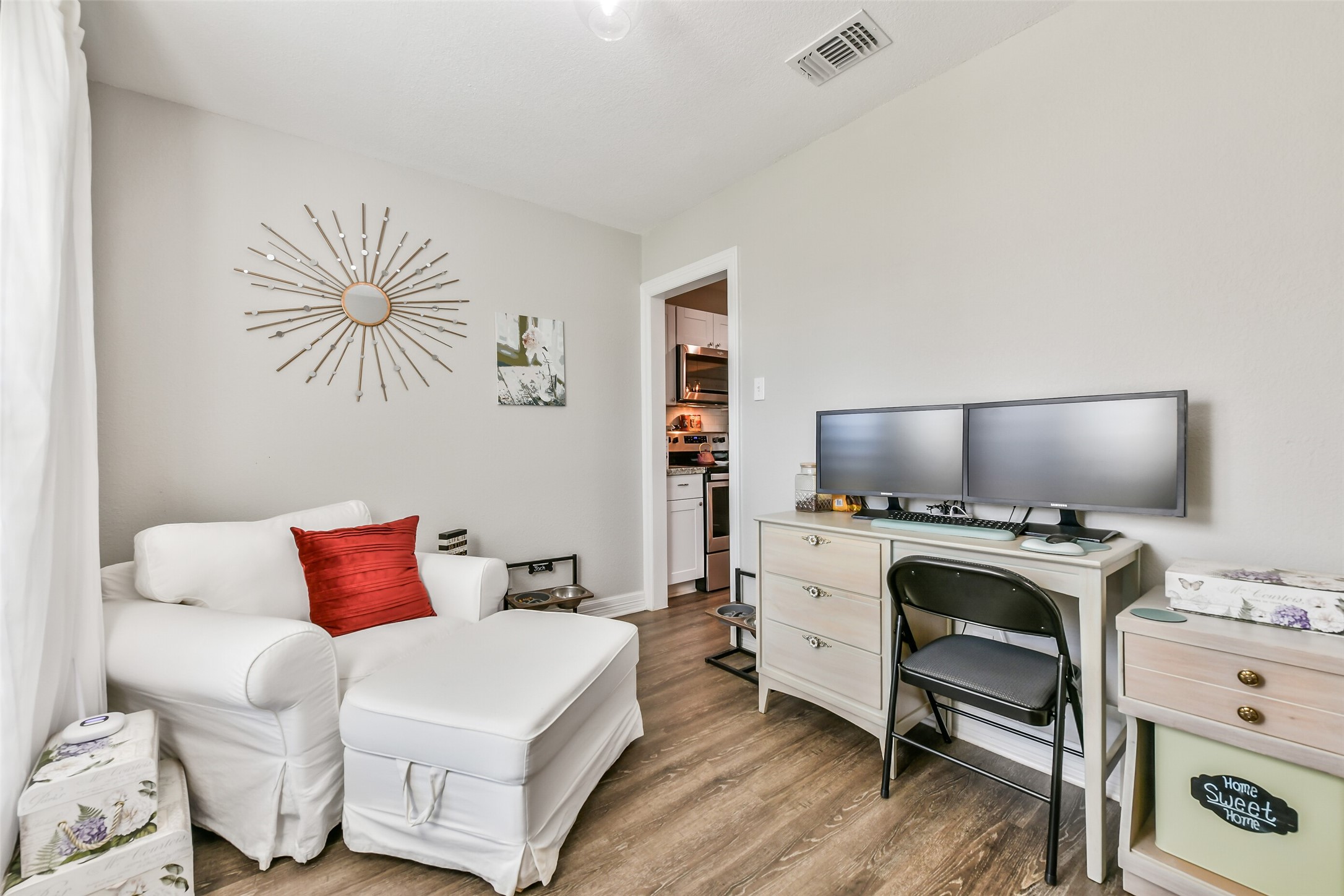 5421 Bramble Lane Dickinson, TX 77539 - Photo 14 of 26 a bedroom with a bed and a flat screen tv