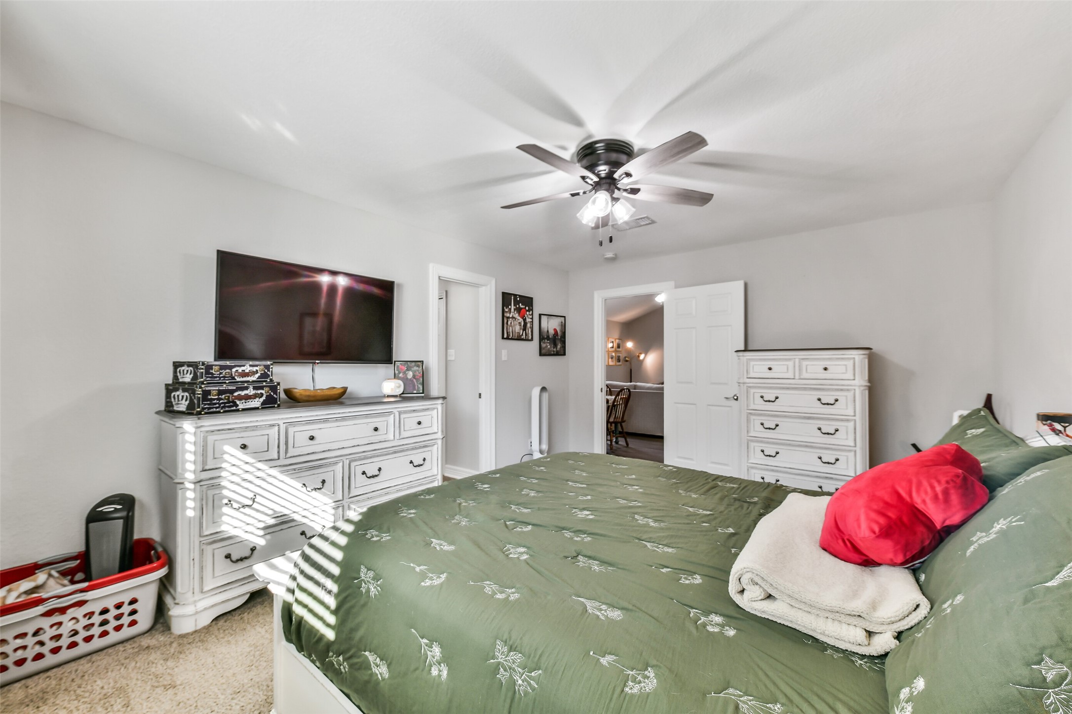 5421 Bramble Lane Dickinson, TX 77539 - Photo 16 of 26 a bedroom with a bed and a flat screen tv