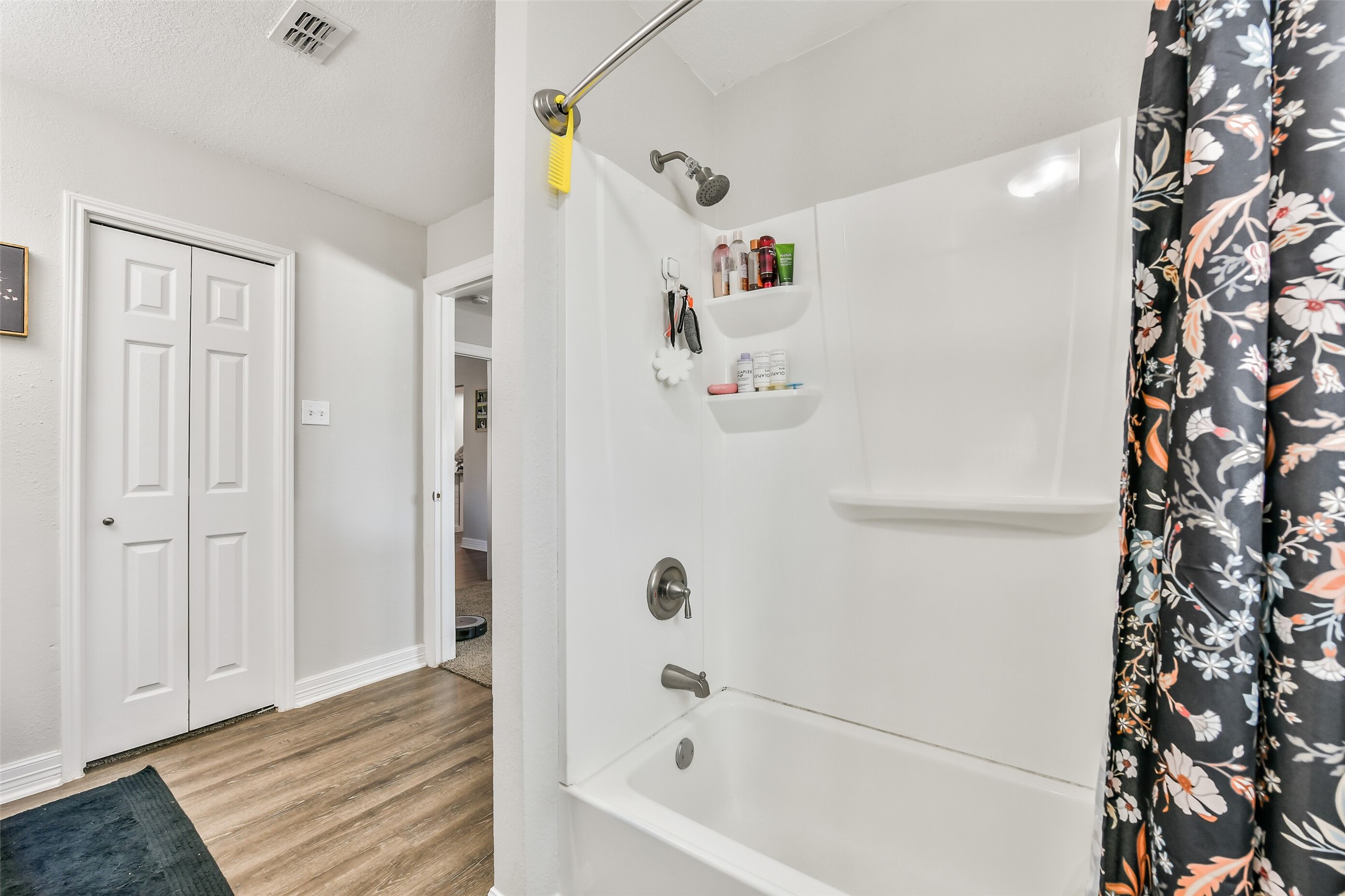 5421 Bramble Lane Dickinson, TX 77539 - Photo 18 of 26 a bathroom with a bathtub and a shower