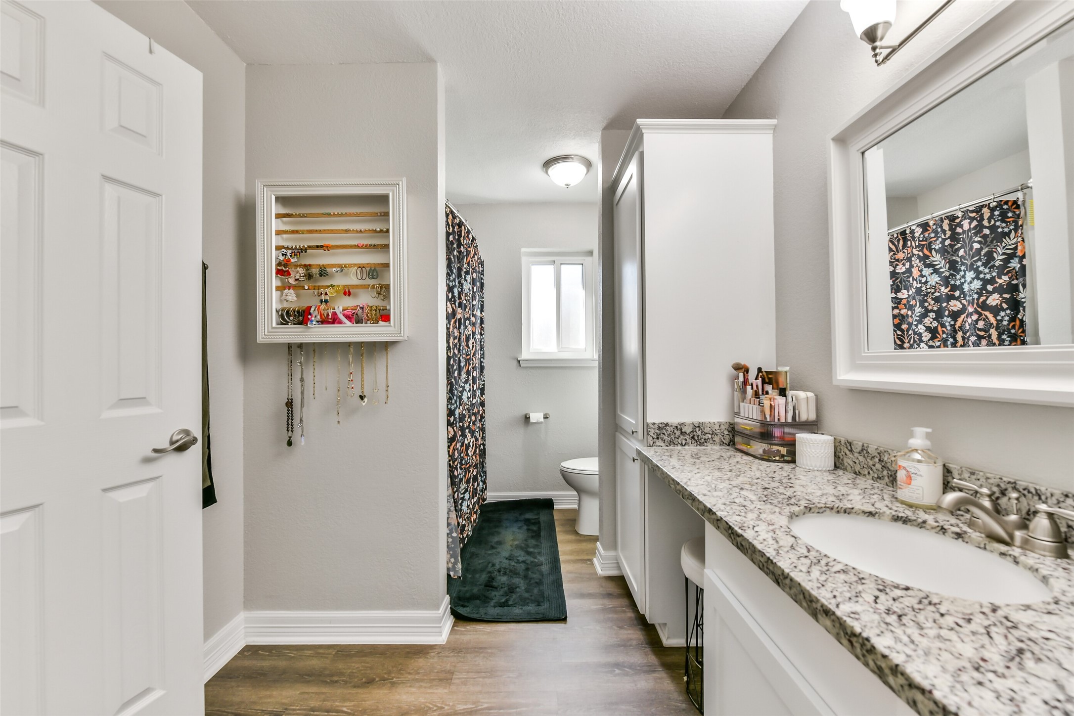 5421 Bramble Lane Dickinson, TX 77539 - Photo 19 of 26 a bathroom with a granite countertop double vanity sink a mirror and a shower