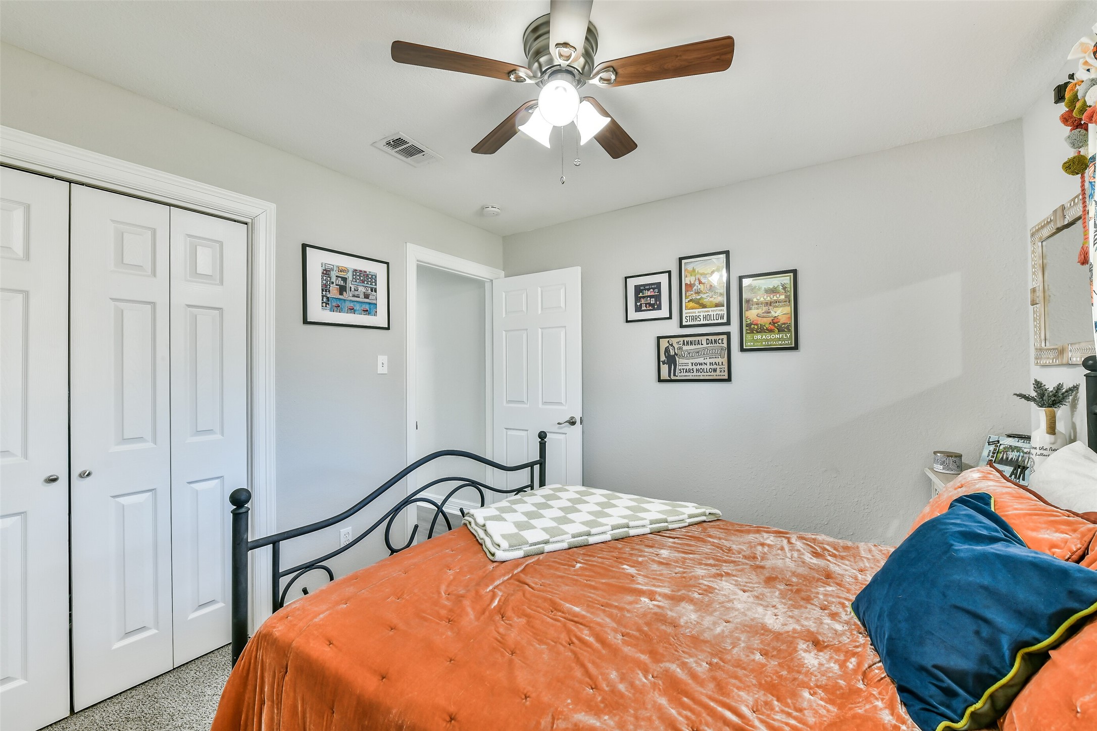 5421 Bramble Lane Dickinson, TX 77539 - Photo 20 of 26 a bedroom with a bed and a chandelier