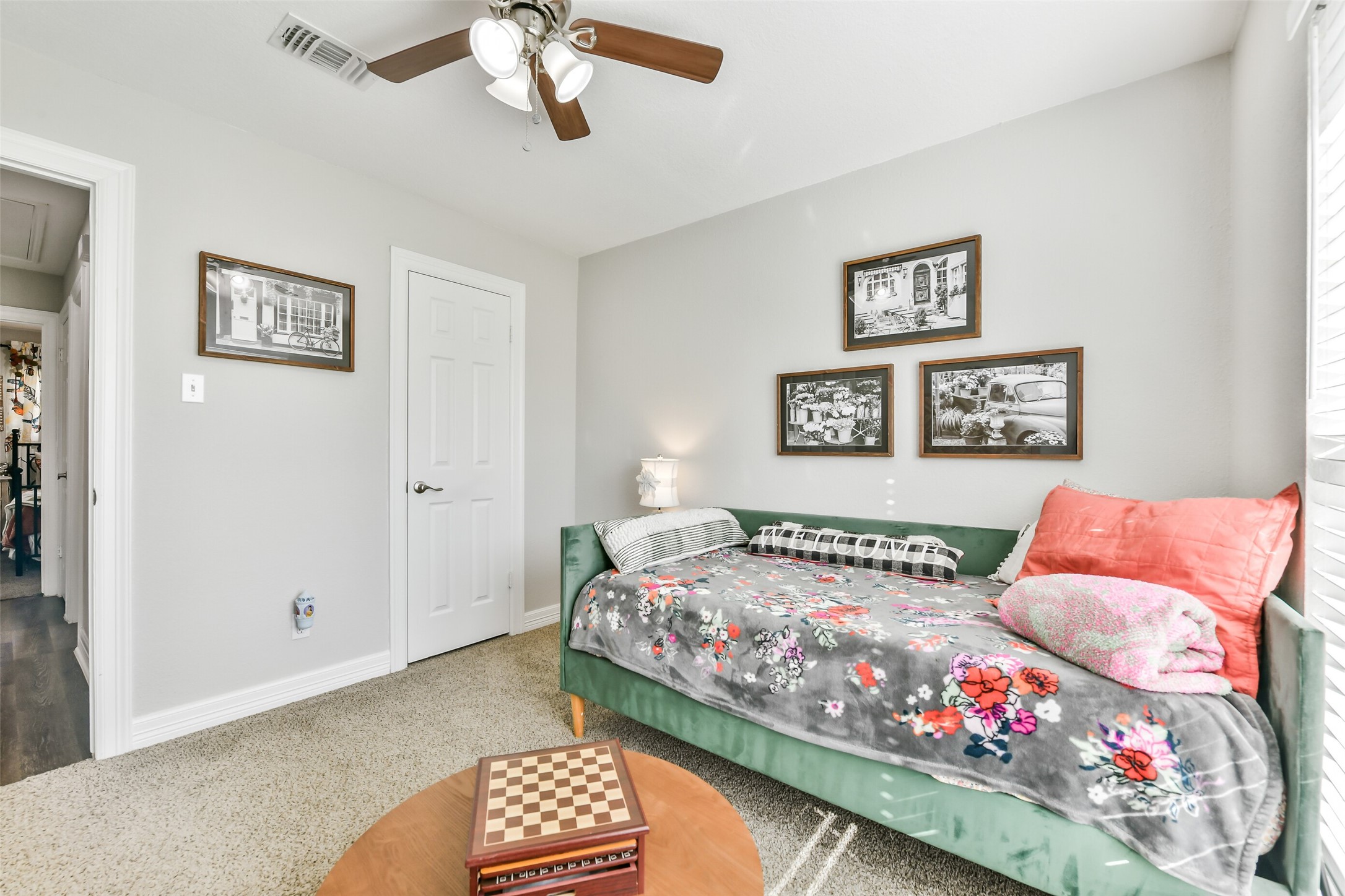 5421 Bramble Lane Dickinson, TX 77539 - Photo 24 of 26 a bedroom with a bed and a chandelier