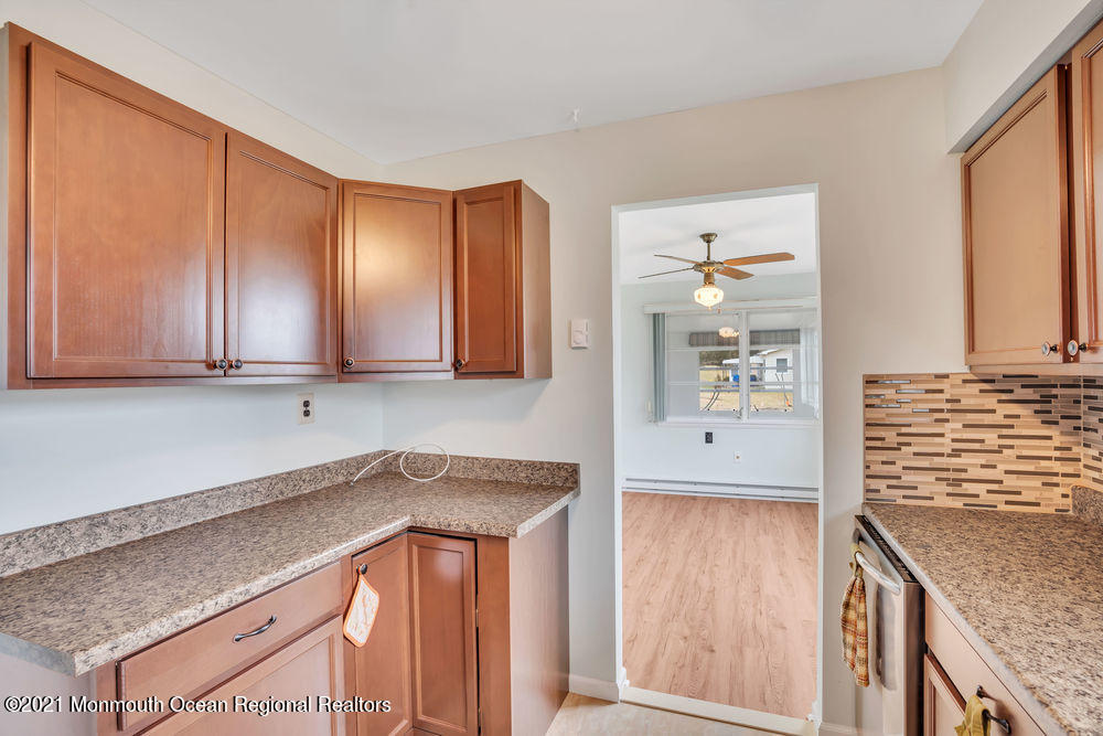 54 Markham Road Brick, NJ 08724 - Photo 20 of 35 a kitchen with granite countertop cabinets and window