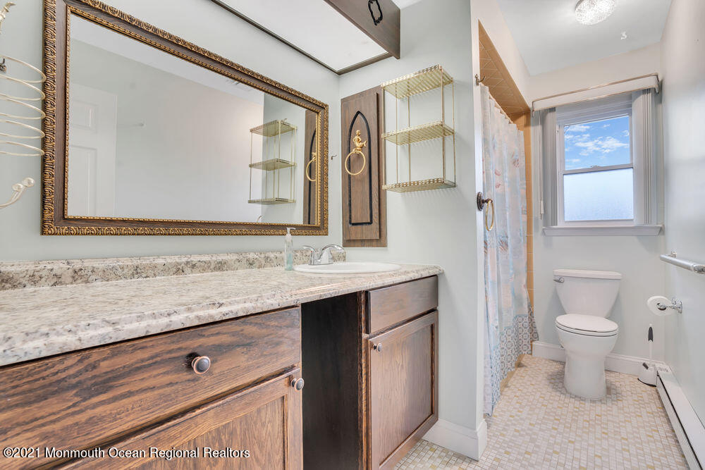 54 Markham Road Brick, NJ 08724 - Photo 23 of 35 a bathroom with a granite countertop sink toilet and mirror