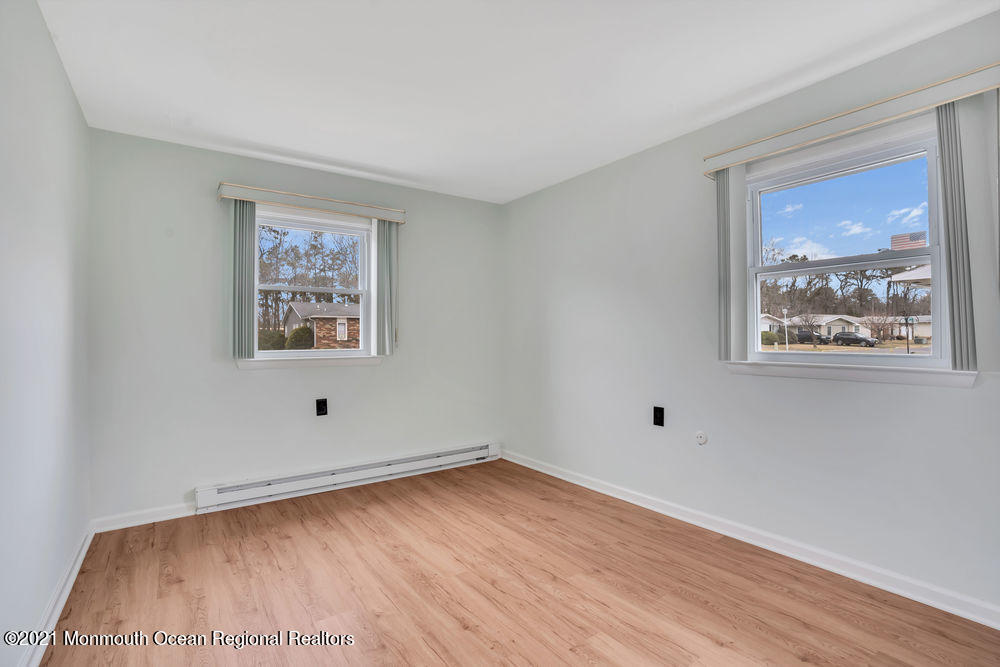 54 Markham Road Brick, NJ 08724 - Photo 25 of 35 an empty room with a painting on the wall