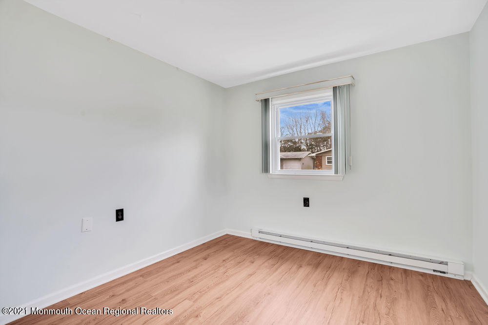 54 Markham Road Brick, NJ 08724 - Photo 26 of 35 a view of empty room with wooden floor