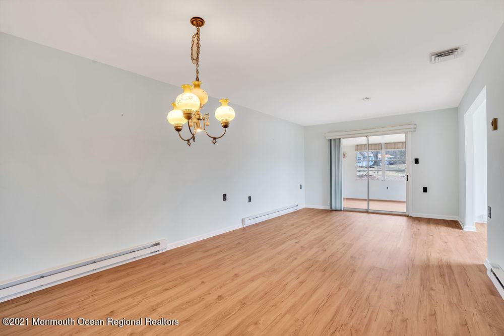 54 Markham Road Brick, NJ 08724 - Photo 7 of 35 a view of a room with wooden floor and window