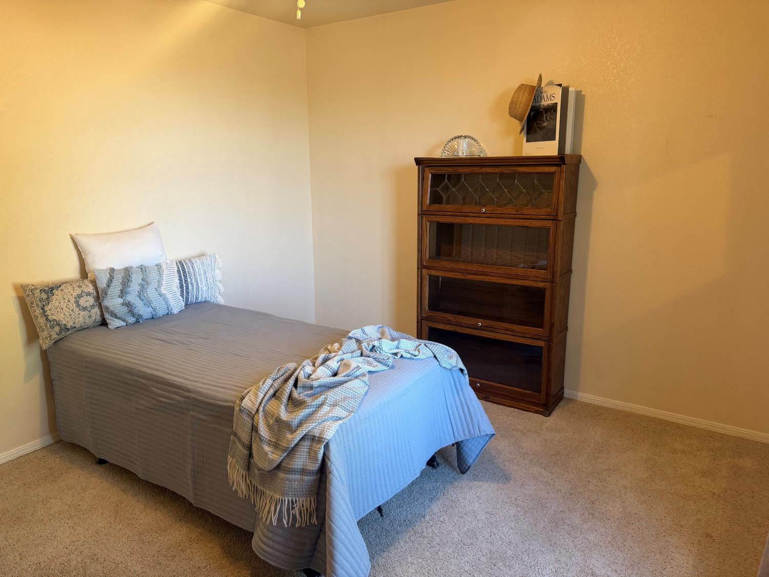 16638 Mark Road Madera, CA 93636 - Photo 14 of 22 a bedroom with a bed and a cabinets