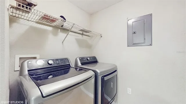 a utility room with dryer and washer