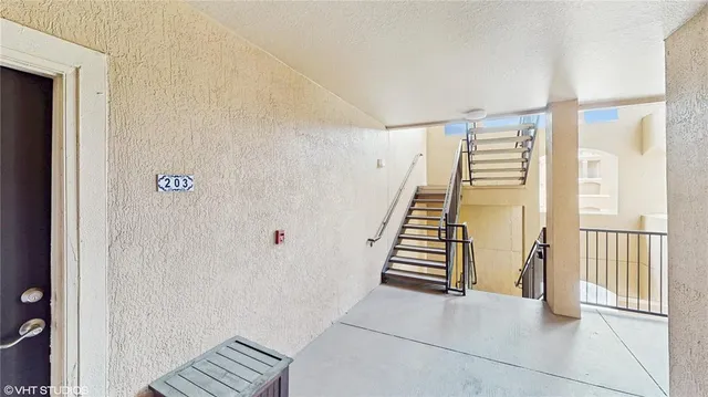 a view of a hallway with staircase