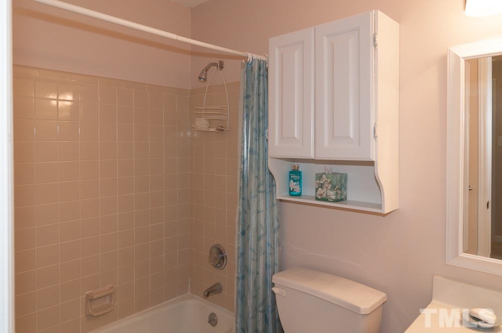1445 Princess Anne Road Raleigh, NC 27607 - Photo 12 of 25 a bathroom with a shower and a toilet