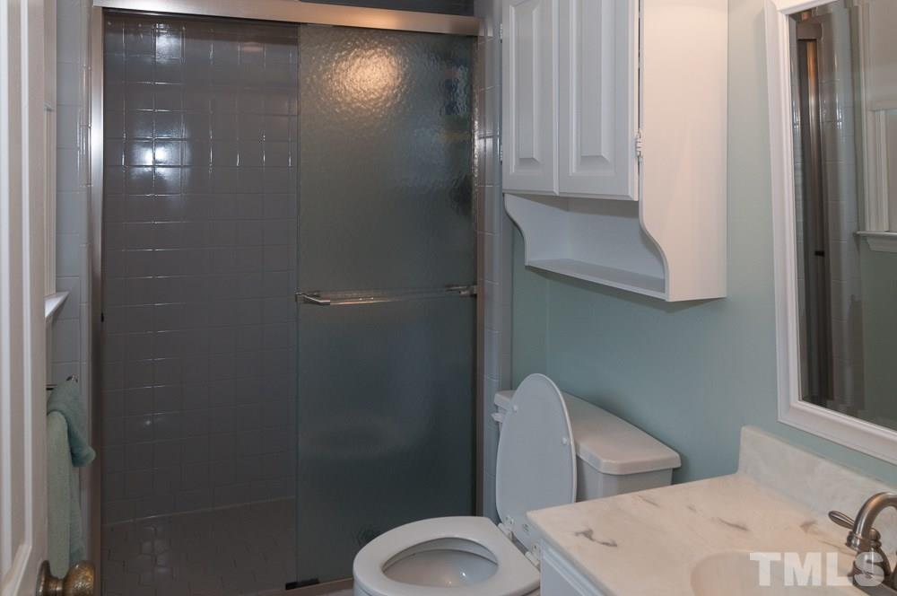 1445 Princess Anne Road Raleigh, NC 27607 - Photo 13 of 25 a bathroom with a toilet and a sink
