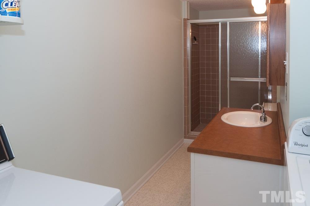 1445 Princess Anne Road Raleigh, NC 27607 - Photo 14 of 25 a bathroom with a sink and a mirror