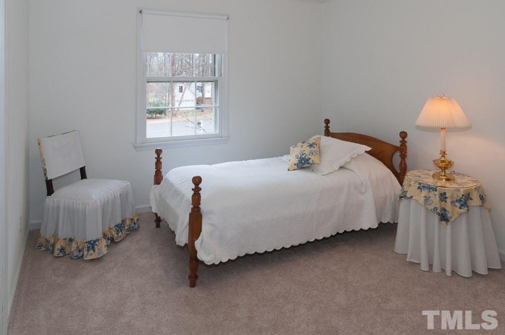 1445 Princess Anne Road Raleigh, NC 27607 - Photo 18 of 25 a bedroom with a bed and a window