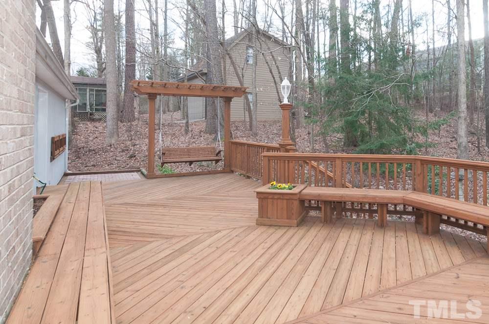 1445 Princess Anne Road Raleigh, NC 27607 - Photo 25 of 25 a balcony with wooden floor and outdoor seating