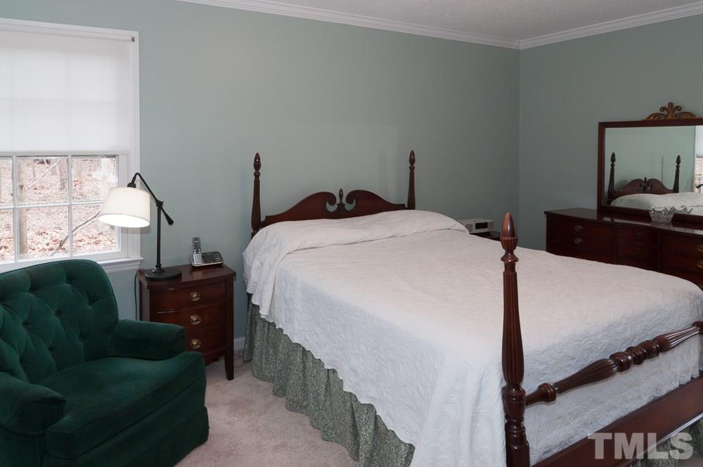 1445 Princess Anne Road Raleigh, NC 27607 - Photo 10 of 25 a bedroom with furniture and a window