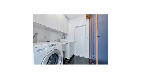 a view of livingroom with washer and dryer