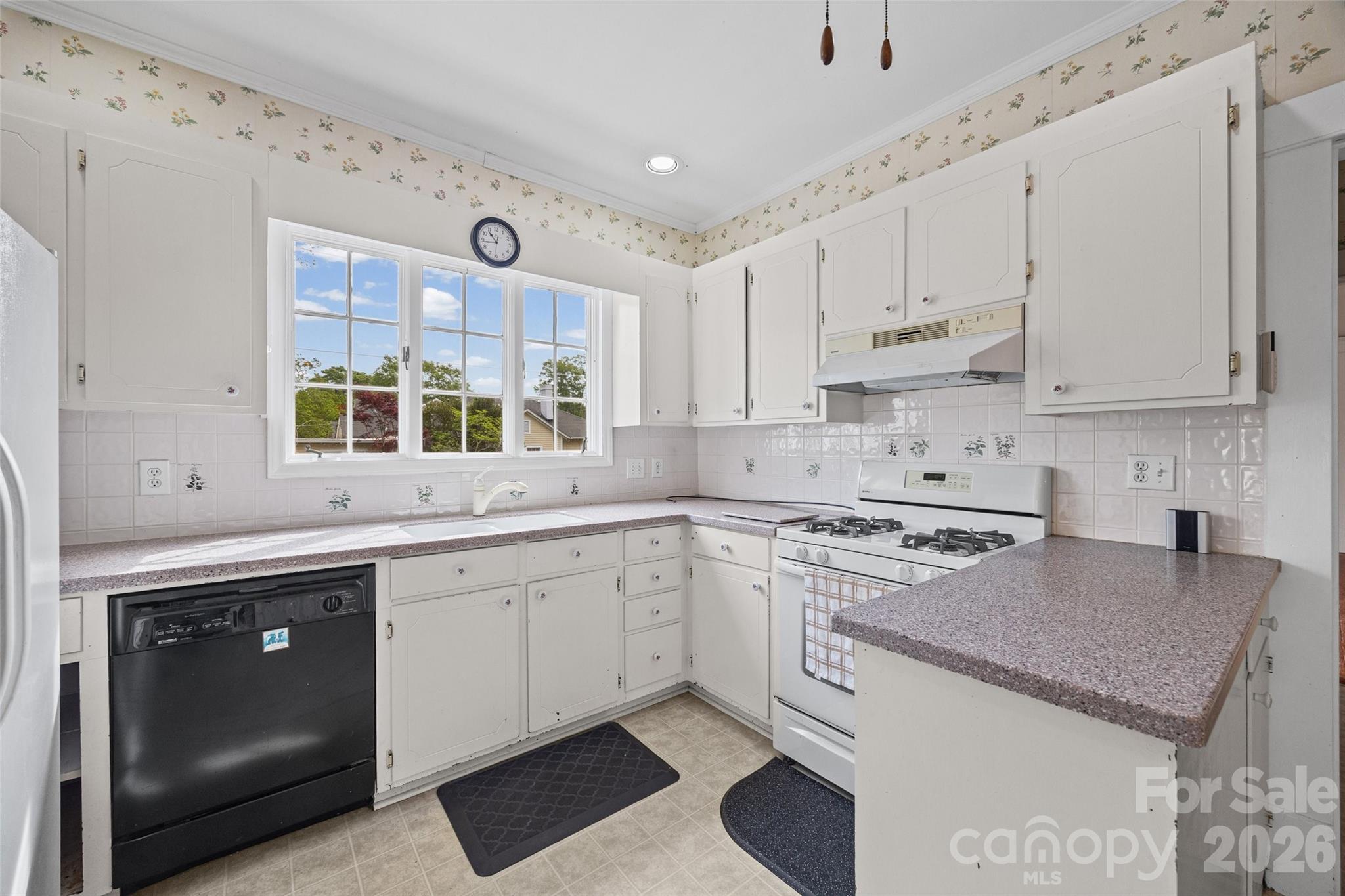 202 Pressley Street Clover, SC 29710 - Photo 16 of 26 a kitchen with a sink stove and cabinets